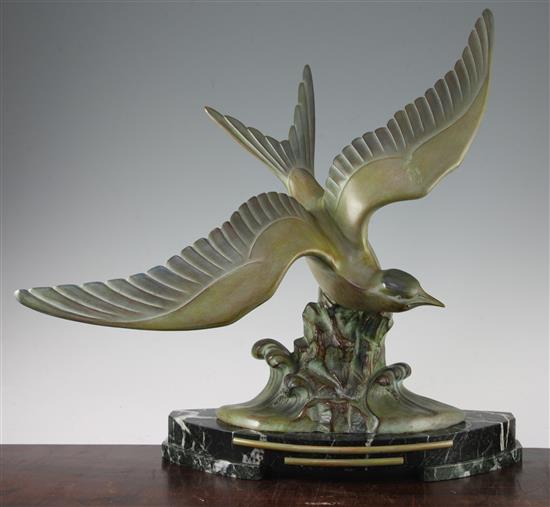 A French Art Deco patinated metal model of a sea bird, 19in.